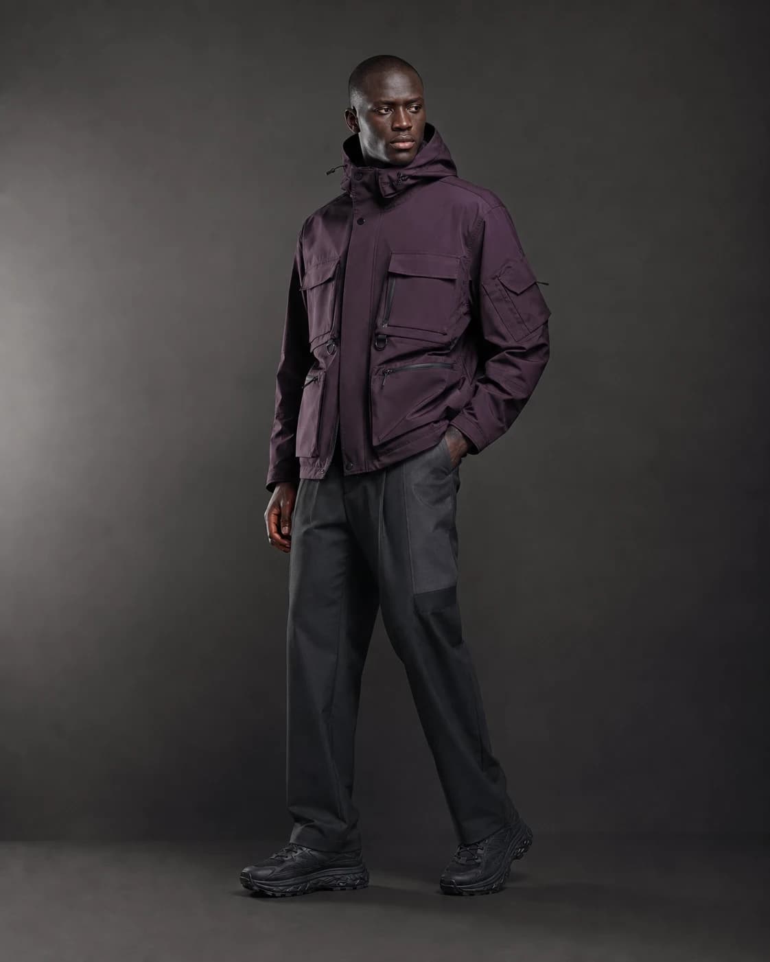 AI-generated model wearing an aubergine technical jacket